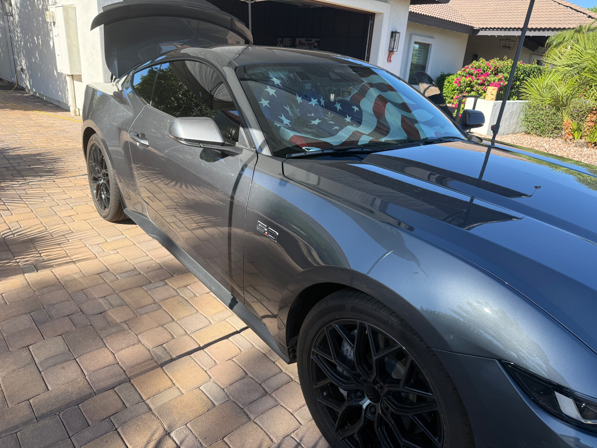 Gray Ford Mustang GT with a glossy finish after its detail