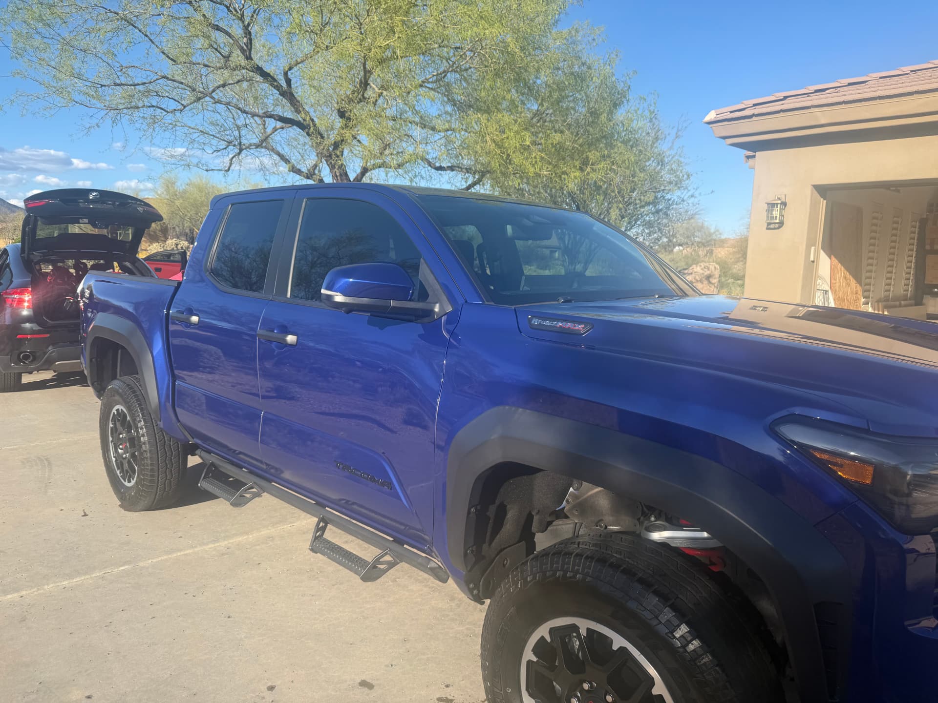 Side profile of a freshly detailed blue Toyota Tacoma